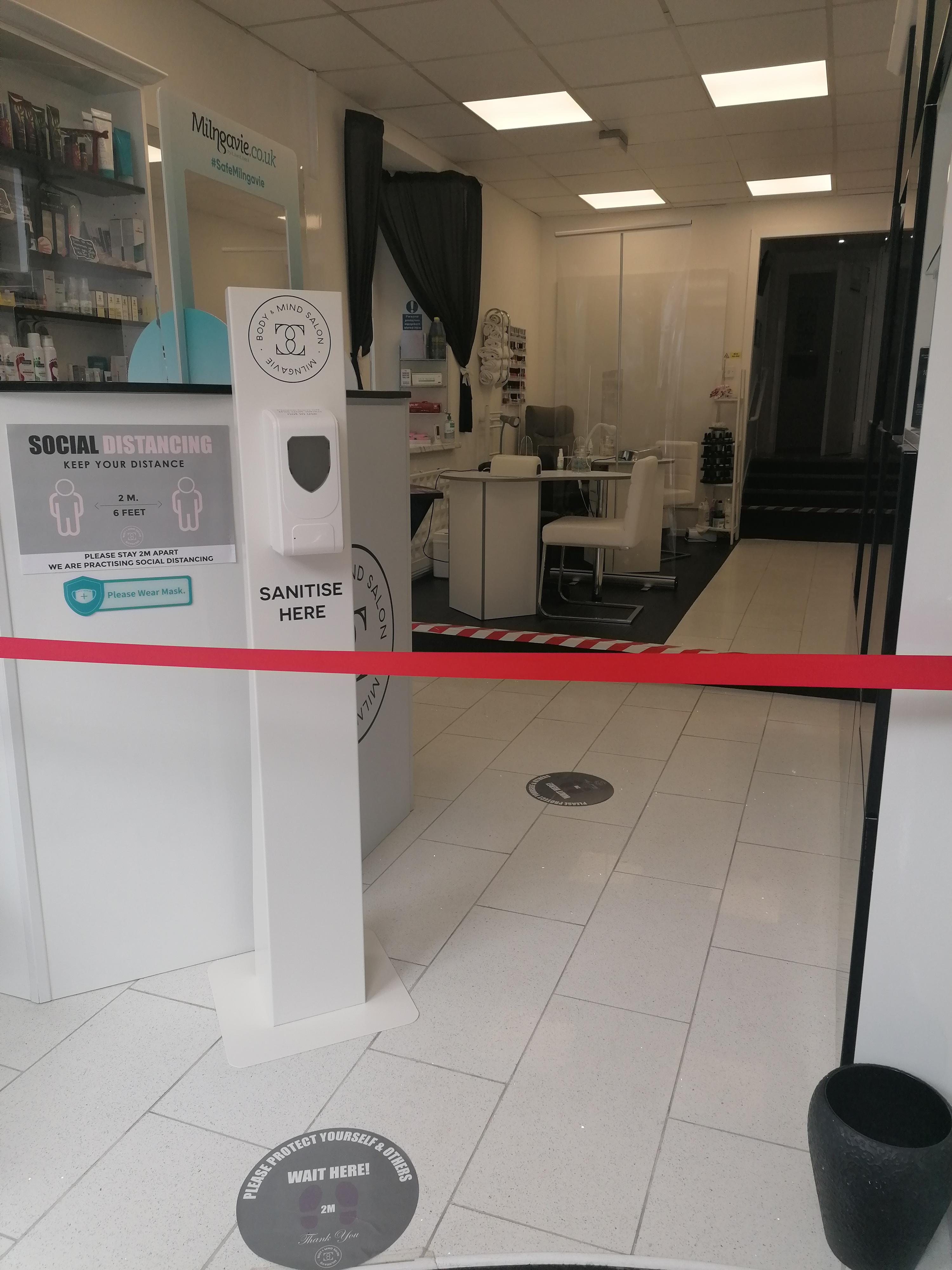 waiting area with desk and hand sanitiser